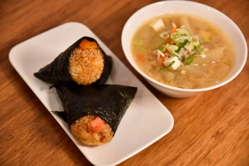 In the front is the “Tarako Butter Soy Sauce Nigiri” for 300 JPN per piece. In the back is the “Miso Egg Yolk (soy sauce nigiri only)” for 360 JPY per piece. Tonjiru (pork miso soup) is 430 JPN per cup.