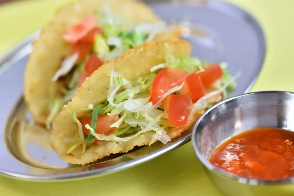 Two pieces of "Happy Tacos" are 440 JPY for eat-in and 432 JPY for take-out, with each piece about the size of two bites.