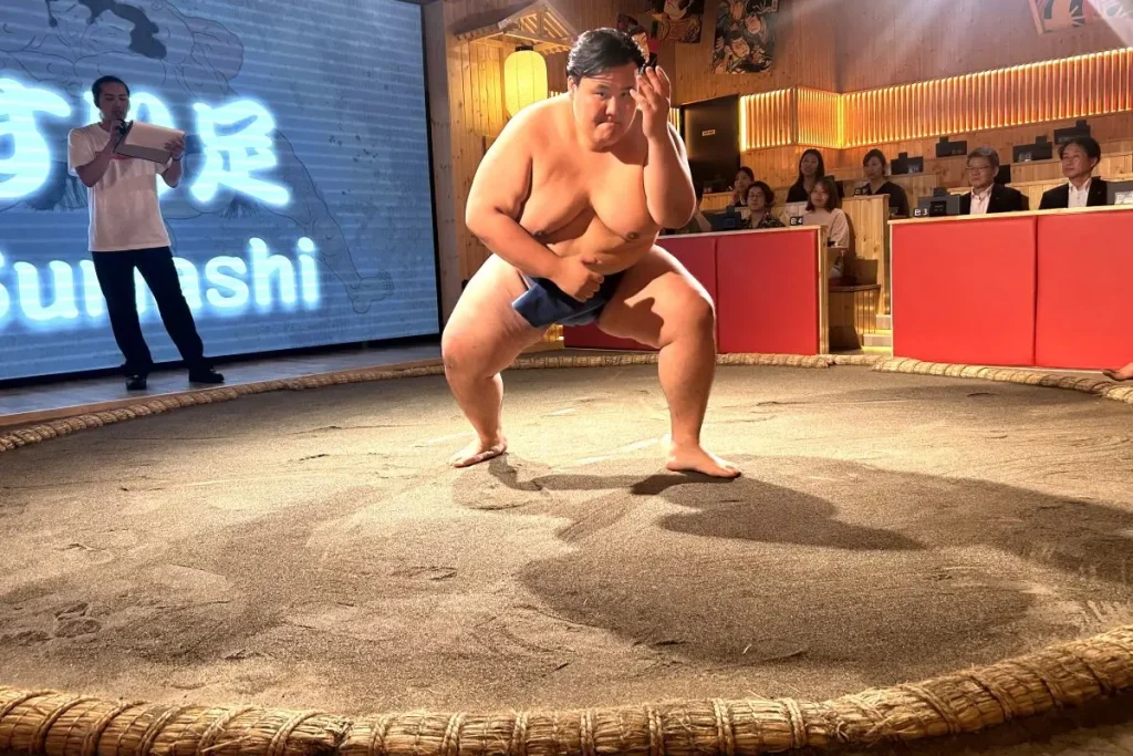 Demonstrating suri-ashi (sliding steps).